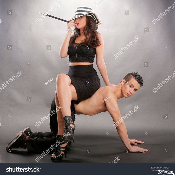 stock-photo-dominant-woman-sits-on-dominated-man-796473757.jpg
